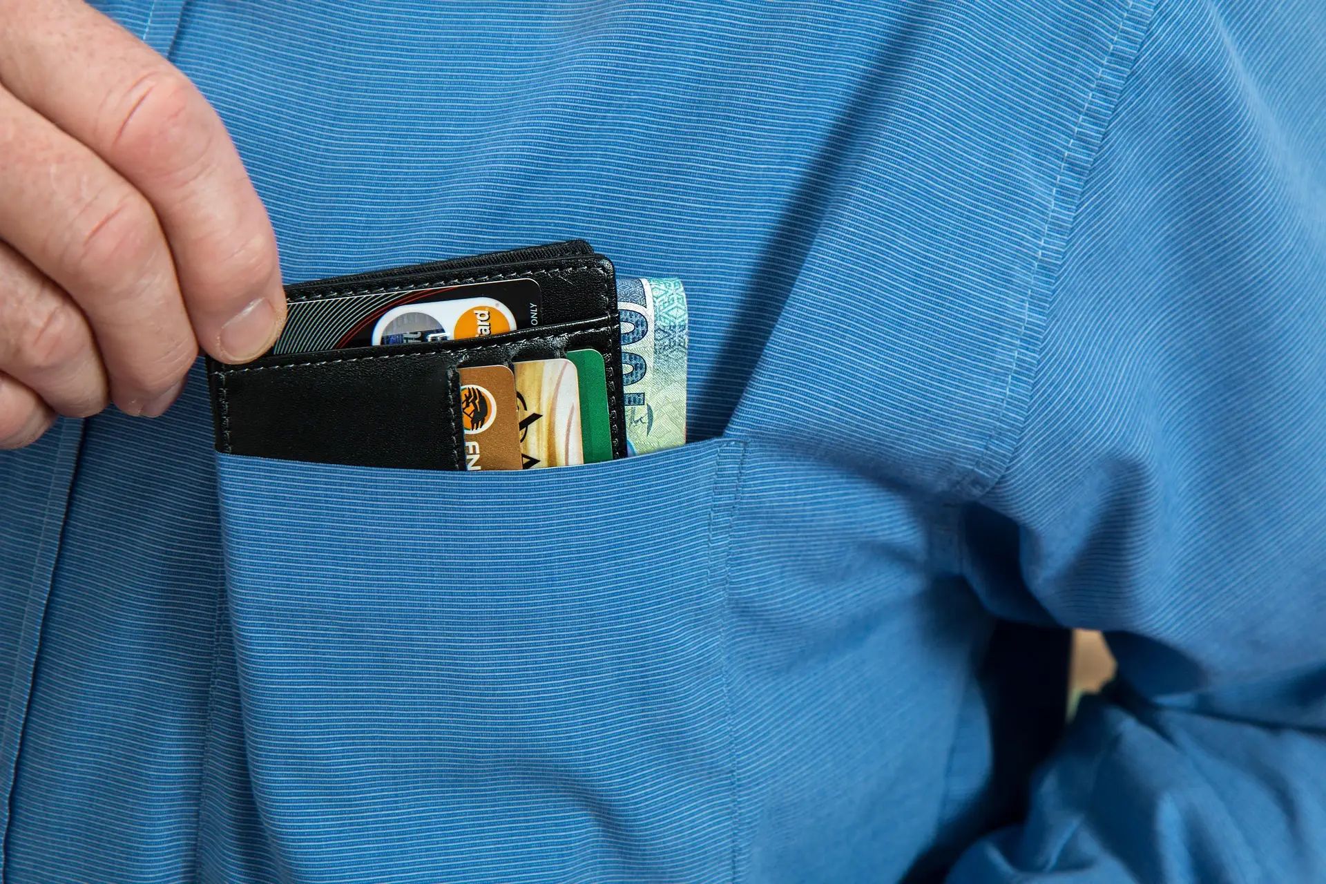Wallet with cards in a shirt pocket